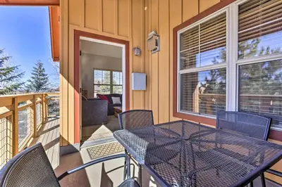 a table and chairs on the balcony of a house at Spacious Fraser Condo about 6 Mi to Winter Park! in Fraser