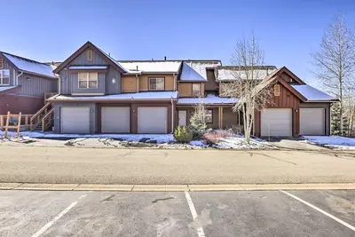 a large house with two garages in a driveway at Spacious Fraser Condo about 6 Mi to Winter Park! in Fraser