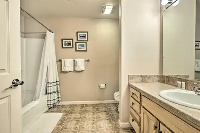 a bathroom with a sink and a tub and a toilet at Spacious Fraser Condo about 6 Mi to Winter Park! in Fraser
