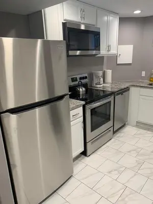 a kitchen with a stainless steel refrigerator and appliances at Cottonwood Loveland in Loveland