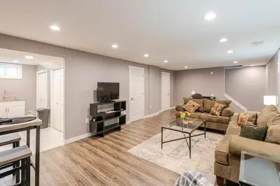 a living room with a couch and a tv at Cottonwood Loveland in Loveland
