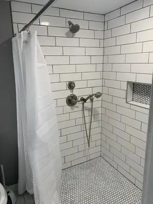 a bathroom with a shower with a shower curtain at Cottonwood Loveland in Loveland