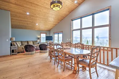 a dining room with a table and chairs at Secluded Granby Mtn Cabin 75 Acres and Views in Granby