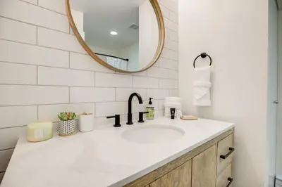 a bathroom with a sink and a mirror at Cedar Lodge Royal Studio Condo: Downtown Frisco in Frisco