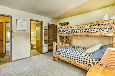 a bedroom with two bunk beds in a room at Winter Park Condo with Hot Tub, 3 Mi to Slopes! in Winter Park