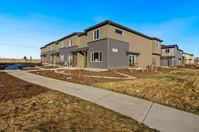 a house under construction with a sidewalk at Hidden Gem - Brand New Curated Home with Pool Access in Fort Collins
