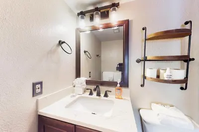 a bathroom with a sink and a mirror at Mountainside Retreat in Frisco