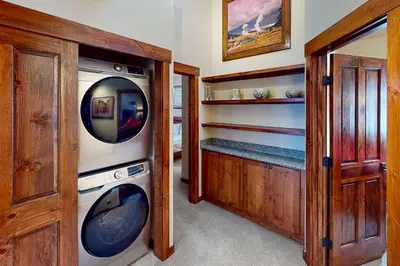 a laundry room with a washer and dryer at Byers Peak Penthouse in Fraser