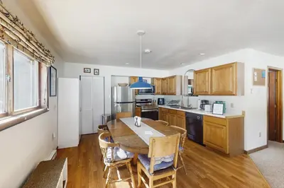 a kitchen with a table and chairs in a room at Skiing Sanctuary in Winter Park