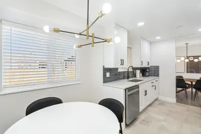 a kitchen and dining room with a table and chairs at #Marbella Lane - Modern & Spacious 4BR Retreat in Arvada in Arvada