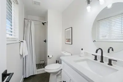 a white bathroom with a sink and a toilet at #Marbella Lane - Modern & Spacious 4BR Retreat in Arvada in Arvada