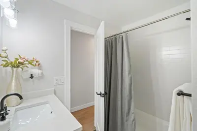 a white bathroom with a sink and a shower at #Marbella Lane - Modern & Spacious 4BR Retreat in Arvada in Arvada