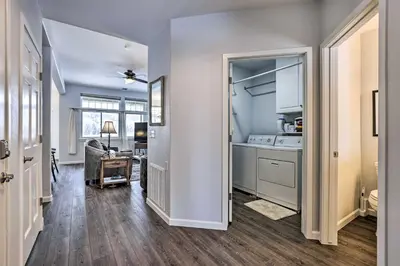 a hallway with a kitchen and a living room at Stunning Mtn Views and Hot Tub Silverthorne Retreat in Silverthorne