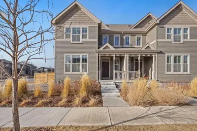a house with a tree in front of it at Modern & Stunning Home near Breweries and Old Town in Fort Collins
