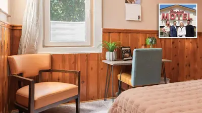 a bedroom with a bed and a table and two chairs at Sloans Lake Walk to eateries bars Free parking in Denver