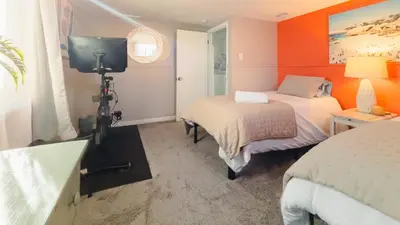 a room with two beds and a camera in it at Sloans Lake Walk to eateries bars Free parking in Denver