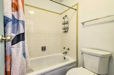 a bathroom with a tub and a toilet and a shower at Grand Lake Condo with Mountain Views Walk to Lake! in Grand Lake