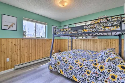 a bedroom with a bunk bed in a room at Grand Lake Condo with Mountain Views Walk to Lake! in Grand Lake