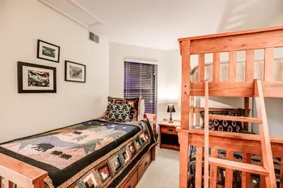 a bedroom with a bunk bed and a ladder at Mountainside Pineview Condo: Cozy Frisco Retreat in Frisco