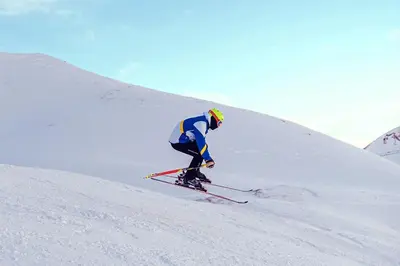 a man is skiing down a snow covered slope at Mountainside Pineview Condo: Cozy Frisco Retreat in Frisco