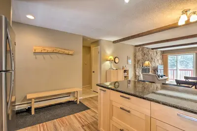 a kitchen with a counter top and a refrigerator at Idyllic Condo about 5 Mi to Winter Park Resort! in Winter Park