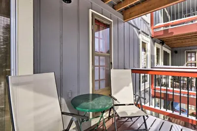 a balcony with a green table and two chairs at Idyllic Condo about 5 Mi to Winter Park Resort! in Winter Park