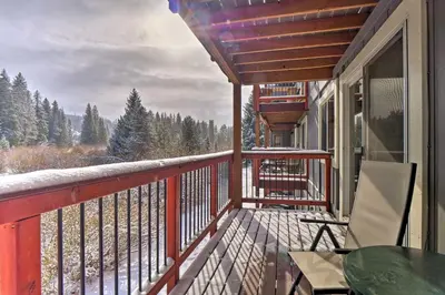 a balcony with a table and chairs and a view at Idyllic Condo about 5 Mi to Winter Park Resort! in Winter Park