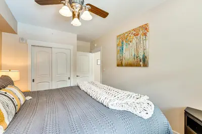 a bedroom with a bed and a ceiling fan at Ski-InandSki-Out Winter Park Condo with Balcony in Winter Park