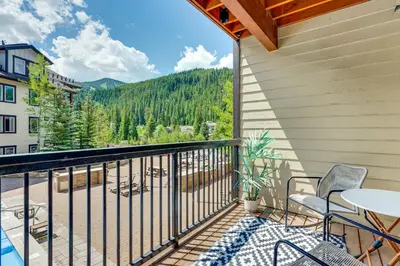a balcony with a table and chairs and a view at Ski-InandSki-Out Winter Park Condo with Balcony in Winter Park