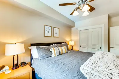a bedroom with a bed and a ceiling fan at Ski-InandSki-Out Winter Park Condo with Balcony in Winter Park