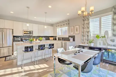 a large kitchen with a table and chairs in it at Private Balcony Pet-Friendly Denver Escape! in Denver