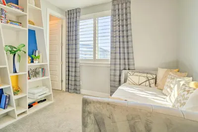 a living room with a couch and a window at Private Balcony Pet-Friendly Denver Escape! in Denver