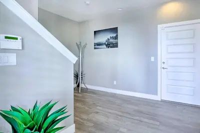 a hallway with a white door and a plant at Private Balcony Pet-Friendly Denver Escape! in Denver