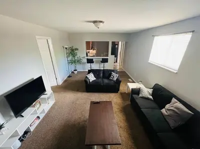 a living room with a couch and a coffee table at Modern Home Near Downtown in Denver