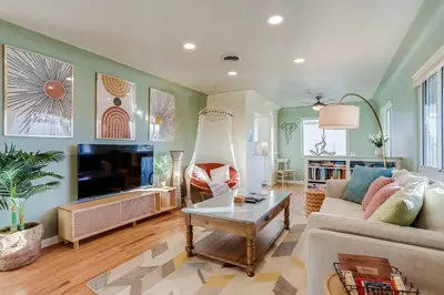 a living room with a couch and a tv at Well-Appointed Family Home in Aurora/Denver Colorado in Aurora