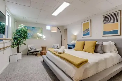 a bedroom with a large bed in a room at Well-Appointed Family Home in Aurora/Denver Colorado in Aurora