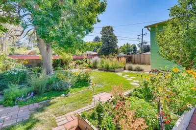 a backyard with a garden with many plants at Well-Appointed Family Home in Aurora/Denver Colorado in Aurora