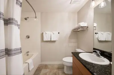 a bathroom with a sink and a toilet and a tub at Premium Unit 3318 - Studio - Fraser Crossing Founders Pointe condo in Winter Park
