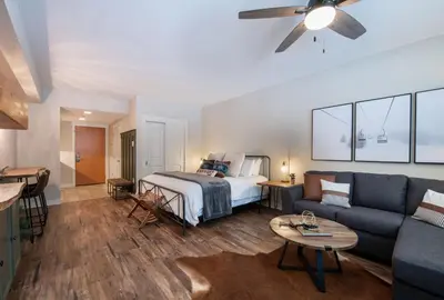 a living room with a bed and a couch at Premium Unit 3318 - Studio - Fraser Crossing Founders Pointe condo in Winter Park