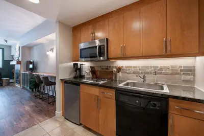 a kitchen with a sink and a microwave at Premium Unit 3318 - Studio - Fraser Crossing Founders Pointe condo in Winter Park