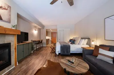 a living room with a bed and a couch at Premium Unit 3318 - Studio - Fraser Crossing Founders Pointe condo in Winter Park