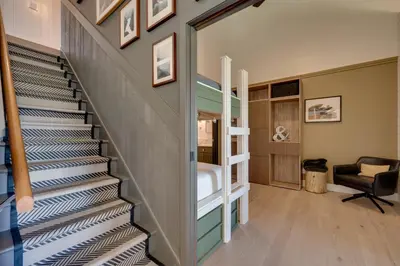 a staircase in a house with a living room at Ski-InandSki-Out Granby Ranch Condo with Mountain View in Granby