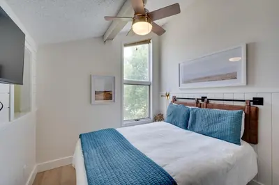 a bedroom with a bed and a ceiling fan at Ski-InandSki-Out Granby Ranch Condo with Mountain View in Granby