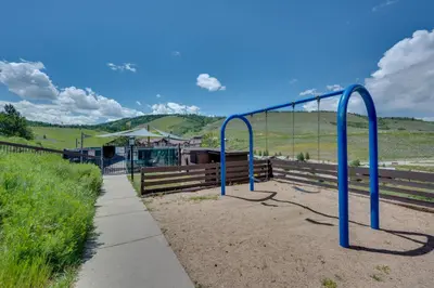 a bus stop with blue poles in the dirt at Ski-InandSki-Out Granby Ranch Condo with Mountain View in Granby