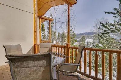 a porch with chairs and a gazebo with a view at Winter Park Condo with Balcony and Mtn Views! in Winter Park