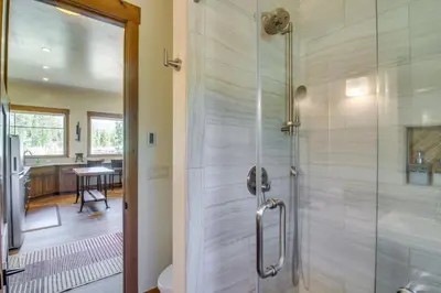 a shower with a glass door in a bathroom at Cozy Fraser Cabin with Views and Moose Sightings! in Fraser