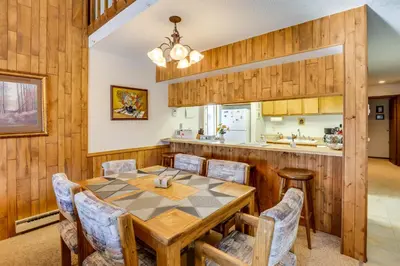 a kitchen and dining room with a table and chairs at Fraser Mountain Retreat with Community Amenities! in Fraser