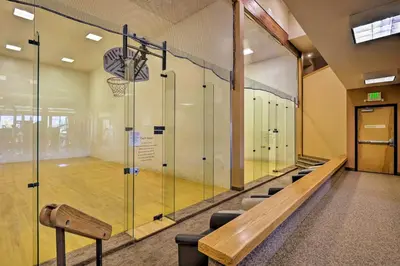 a basketball court with a bench and a basketball hoop at Fraser Mountain Retreat with Community Amenities! in Fraser