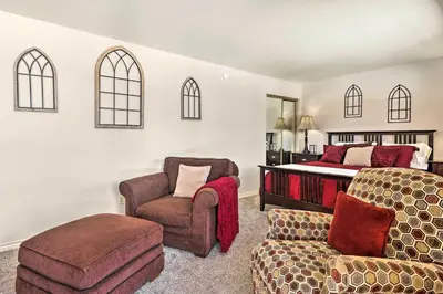 a bedroom with a bed and a chair and a couch at 3 Mi to National Park Cozy Studio in Grand Lake in Grand Lake