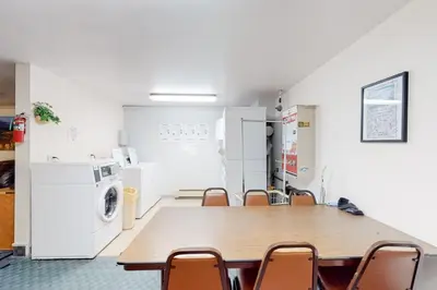 a conference room with a table and chairs at Coziest Condo in Winter Park